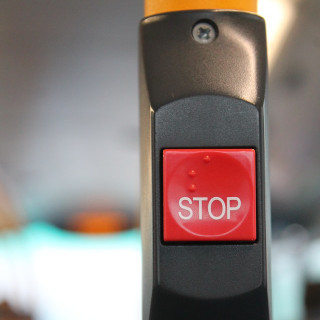 A picture of a button labelled stop